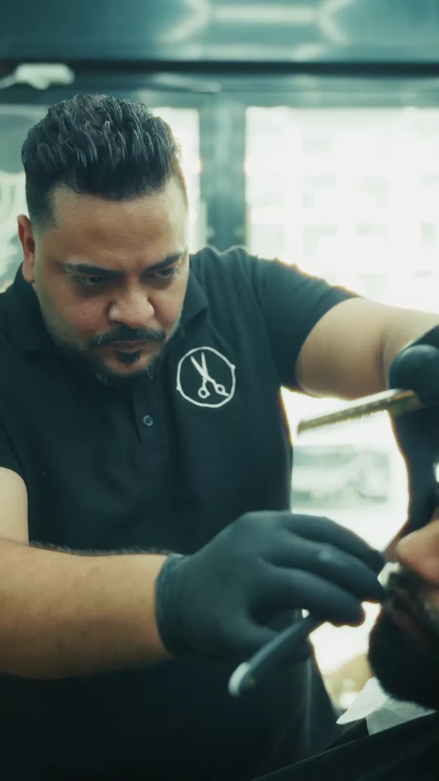 Amr working at The Vintage Barbershop